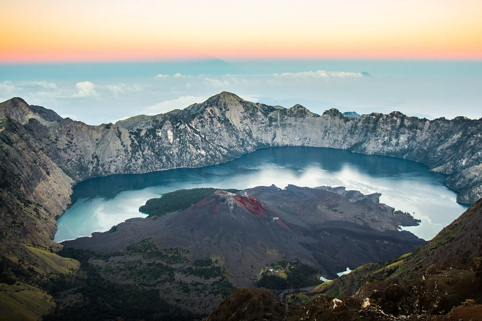 Dawn light over the caldera rim, with the lake and the Barujari cone below